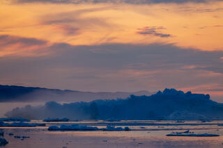 Setting sun on Disko Bay Greenland.