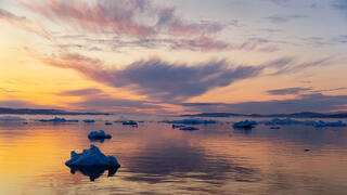 Setting sun on Disko Bay Greenland.