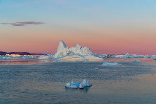 Iceberg field in midnight sun on Disko Bay Greenland 