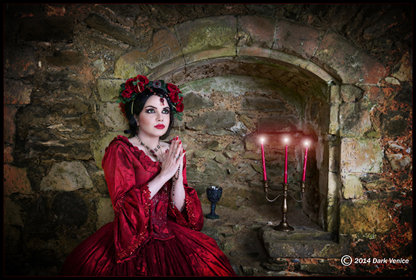 Netley Abbey, woman in Red, red candles, woman in red dress prayer in Netlet Abbey ruins