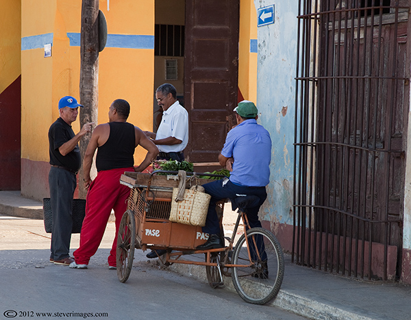 Strret corner conversation, Trinidad, Cuba, Images of men having a street corner conversation in trinidad
