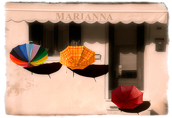 This image was taken in 2008. The sun had come out after some heavy rain, hence the umbrellas were left out to dry. I did quite...