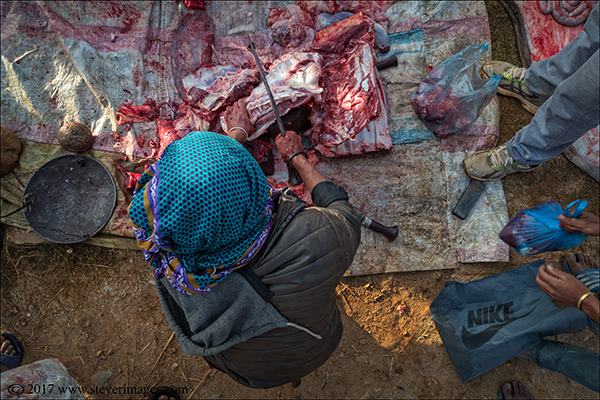 Nepal, outdoor, cutting meat