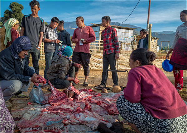 Nepal, outdoor, cutting meat